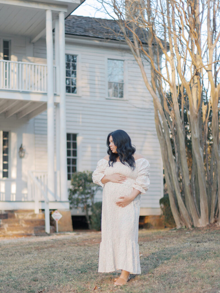 Gwinnett County maternity photos  with expectant mother posing at sunset