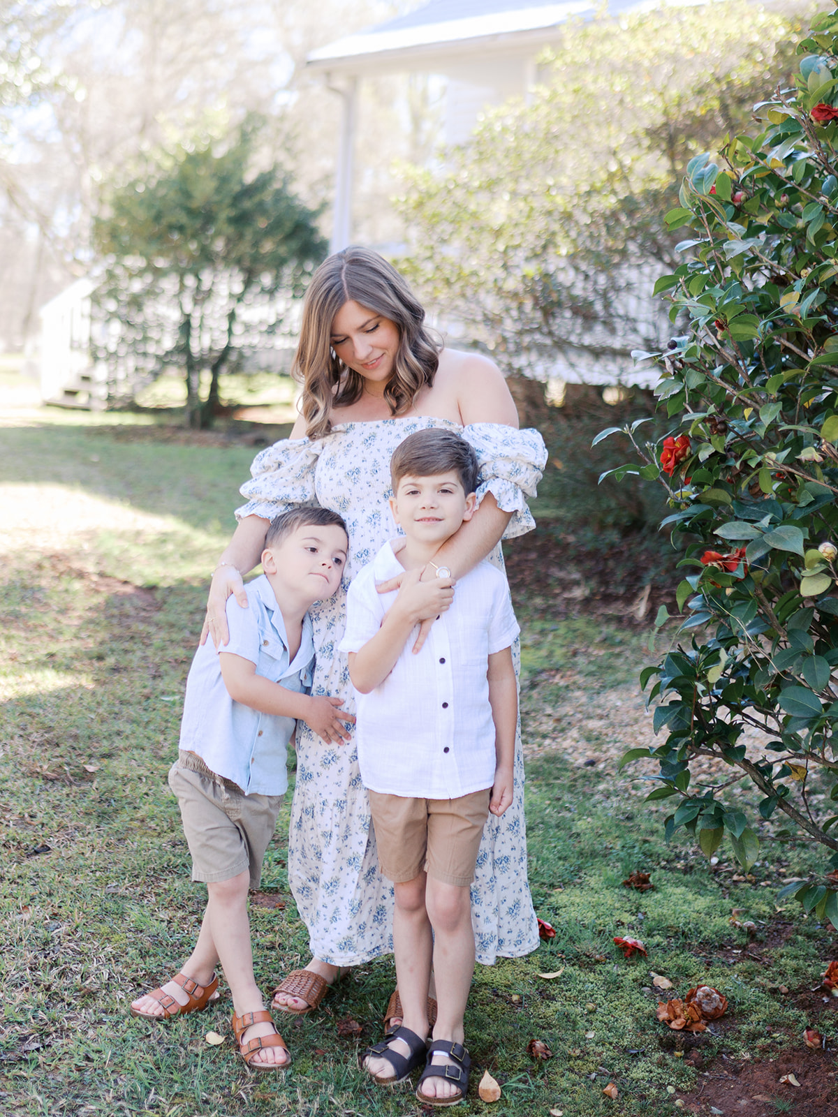 A mother stands with her children in a garden in dacula georgia