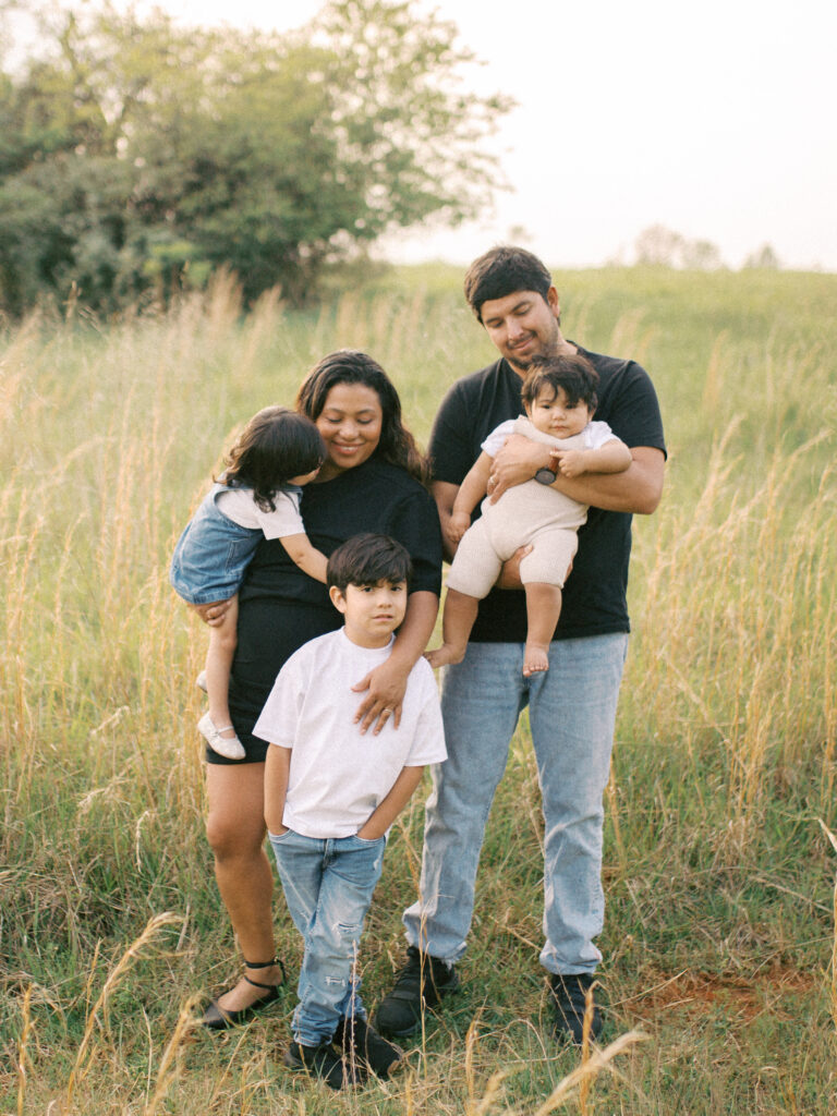 family of 5 in an open field at little mulberry park dacula